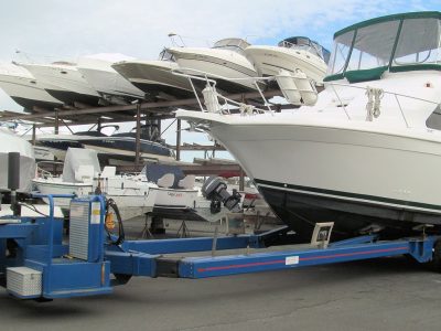 Powerboat raised on a hydraulic marine lift for service.