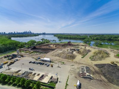 Camden, New Jersey riverfront redevelopment site with the Philadelphia skyline visible across the Delaware River.