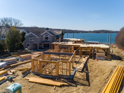 Two-story wood-framed home under construction overlooking the water in Northport, Long Island.